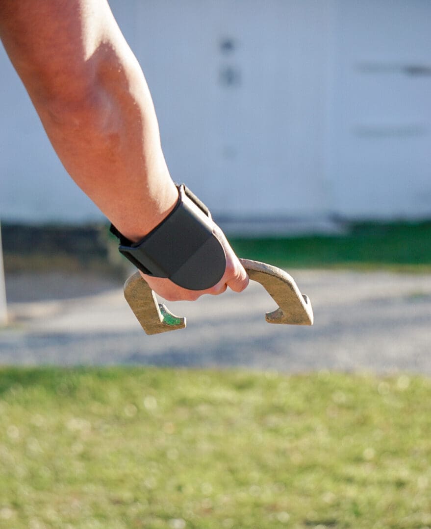 A person with a pair of shoes in the air