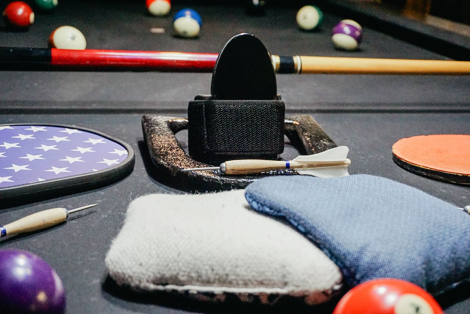 A pool table with some items on it